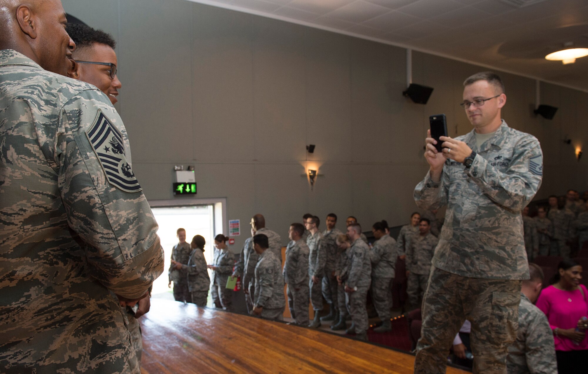Chief Master Sgt. of the Air Force, Kaleth O. Wright, takes the time to have his photo taken with Airmen from the 501st Combat Support Wing (CSW) and partnering tenant units during an all call on Aug. 3, 2018 at RAF Alconbury, United Kingdom. The purpose of his visit was to meet the Airmen, speak about some current Air Force topics and learn more about the 501st CSW mission. (U.S. Air Force photo by TSgt. Brian Kimball)