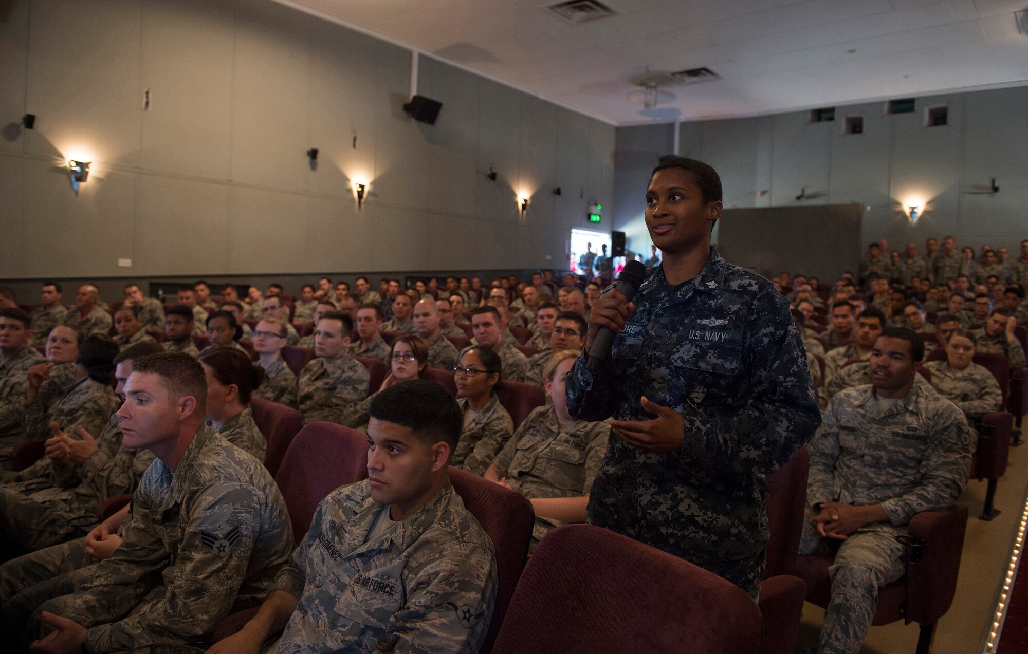 A U.S. Navy Petty Officer 3rd Class asks Chief Master Sgt. of the Air Force, Kaleth O. Wright, a question concerning the different branches of military service during an all call on Aug. 3, 2018 at RAF Alconbury, United Kingdom. The purpose of his visit was to meet  with U.S. Air Force, speak about some current Air Force topics and learn more about the 501st CSW mission. (U.S. Air Force photo by TSgt. Brian Kimball)