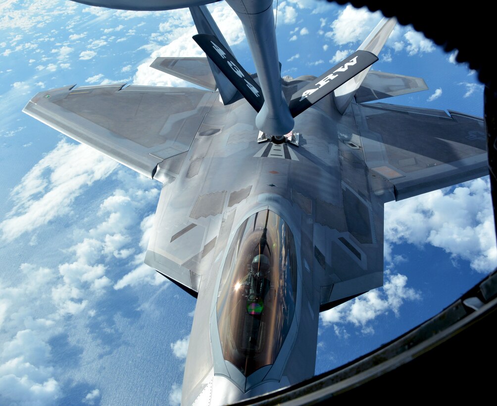 A 154th Wing Hawaii Air National Guard F-22 Raptor refuels from a 434th Air Refueling Wing KC-135 Stratotanker from Grissom Air Reserve Base, Indiana, while in flight near Hawaii during the Rim of the Pacific (RIMPAC) exercise July 17. Twenty-five nations, 46 ships, five submarines, and about 200 aircraft and 25,000 personnel are participating in RIMPAC from June 27 to Aug. 2 in and around the Hawaiian Islands and Southern California. The world’s largest international maritime exercise, RIMPAC provides a unique training opportunity while fostering and sustaining cooperative relationships among participants critical to ensuring the safety of sea lanes and security of the world’s oceans. RIMPAC 2018 is the 26th exercise in the series that began in 1971. (U.S. Air Force photo by Tech. Sgt. Samantha Mathison)