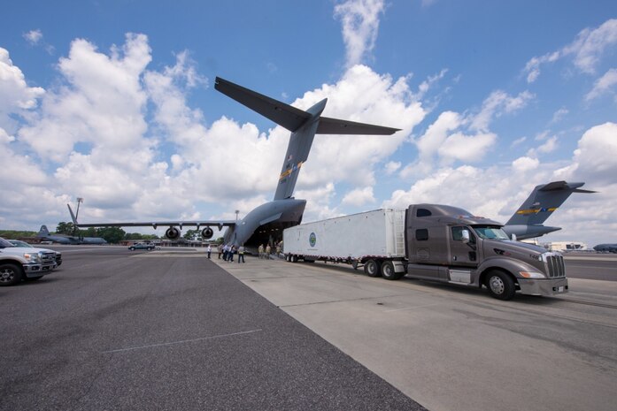 Members of the 437th Aerial Port Squadron conduct a test load of a Large Mobile Air Traffic Control Tower onto a C-17 Globemaster III July 26, 2018, at the Joint Base Charleston Air Base.