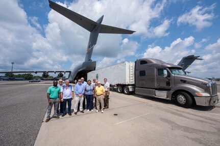 Space and Naval Warfare Systems Center Atlantic engineers and officials from the Federal Aviation Administration pause for a photo following a test load of a Large Mobile Air Traffic Control Tower onto a C-17 Globemaster III July 26, 2018, at the Joint Base Charleston Air Base.