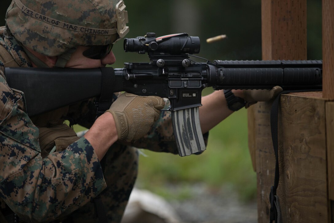 Cpl. Gary Denson, with Charlie Company, 1st Battalion, 23rd Marine Regiment, a competitor in the 4th Marine Division Annual Rifle Squad Competition, conducts an Unknown Distance course of fire at Joint Base Elmendorf-Richardson, Anchorage, Alaska, August 2, 2018. Super Squad Competitions were designed to evaluate a 14-man infantry squad throughout an extensive field and live-fire evolution. (U.S. Marine Corps photo by Lance Cpl. Samantha Schwoch/released)