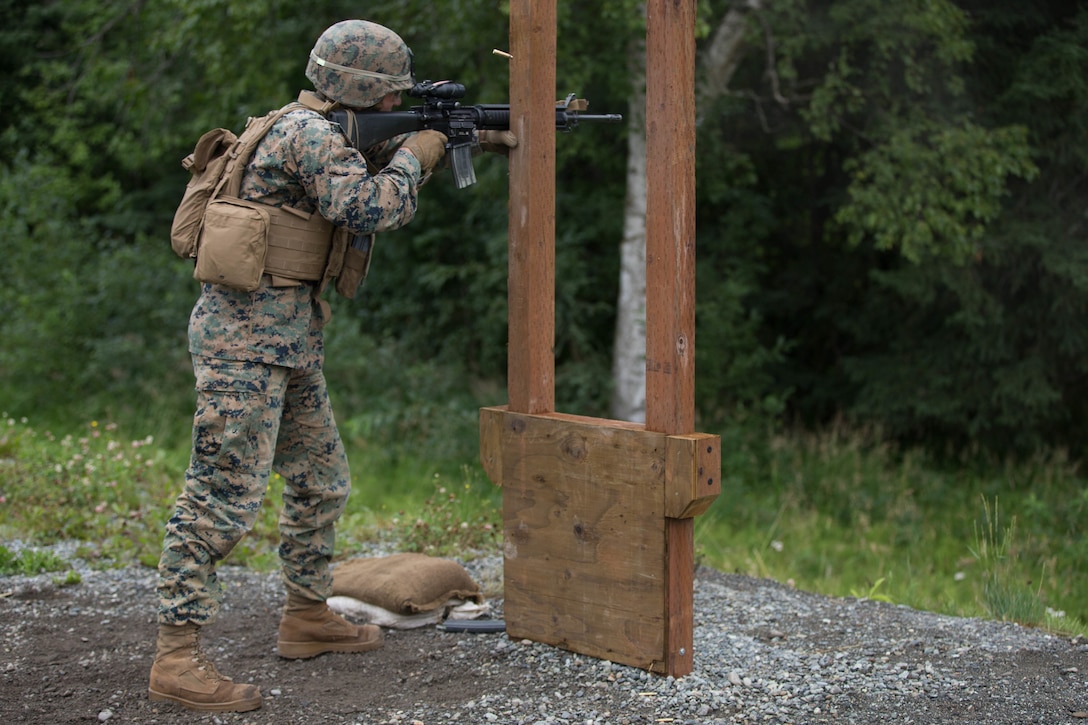 Lance Cpl. Albert Rivera, with Charlie Company, 1st Battalion, 24th Marine Regiment, 25th Marine Regiment, a competitor in the 4th Marine Division Annual Rifle Squad Competition, conducts an Unknown Distance course of fire at Joint Base Elmendorf-Richardson, Anchorage, Alaska, August 2, 2018. Super Squad Competitions were designed to evaluate a 14-man infantry squad throughout an extensive field and live-fire evolution. (U.S. Marine Corps photo by Lance Cpl. Samantha Schwoch/released)