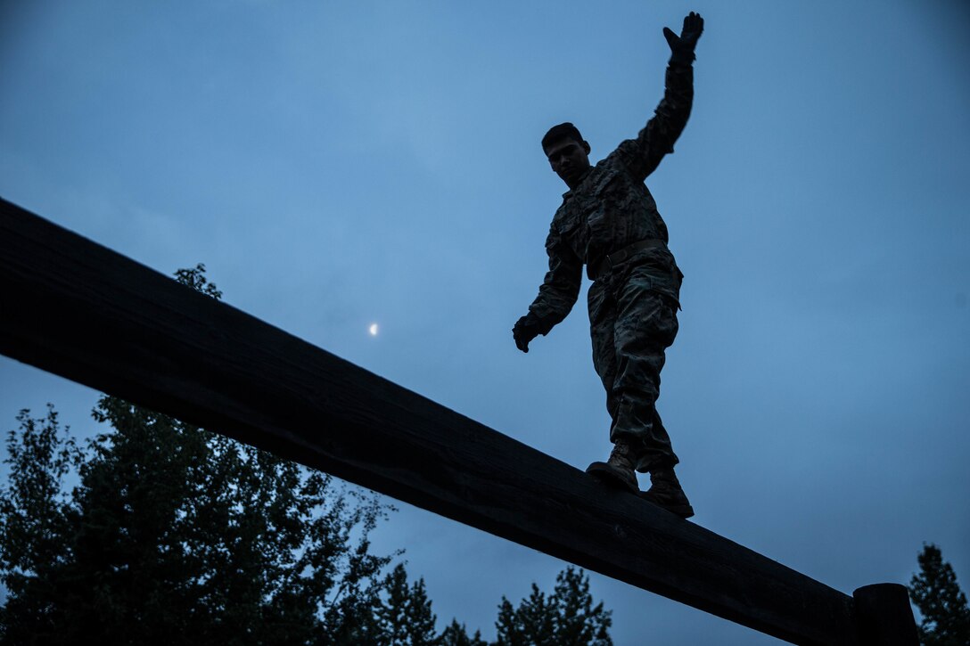 Marines with Charlie Company, 1st Battalion, 23rd Marine Regiment, competing in the 4th Marine Division Annual Rifle Squad Competition, tackle a two-hour timed obstacle course at Joint Base Elmendorf-Richardson, Anchorage, Alaska, August 3, 2018. Super Squad Competitions were designed to evaluate a 14-man infantry squad throughout an extensive field and live-fire evolution. (U.S. Marine Corps photo by Lance Cpl. Samantha Schwoch/released)