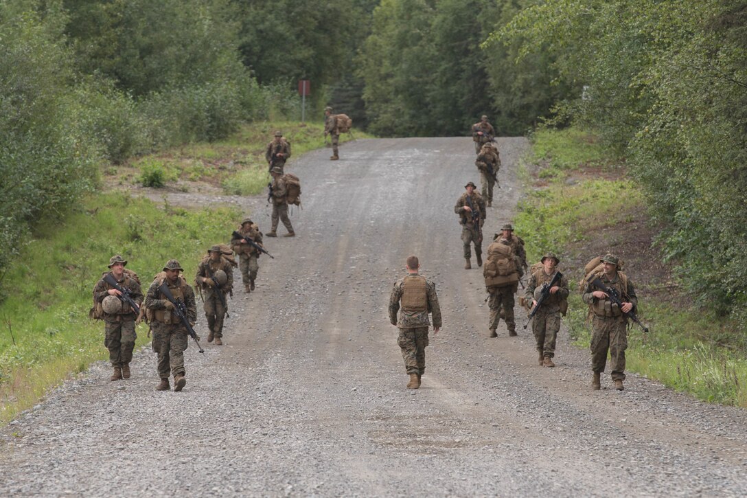 Marines with Charlie Company, 1st Battalion, 23rd Marine Regiment, competing in the 4th Marine Division Annual Rifle Squad Competition, conduct a patrol to Landing Zone 26 at Joint Base Elmendorf-Richardson, Anchorage, Alaska, Aug. 3, 2018. Super Squad Competitions were designed to evaluate a 14-man infantry squad throughout an extensive field and live-fire evolution. (U.S. Marine Corps photo by Lance Cpl. Samantha Schwoch/released)