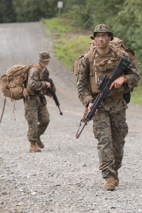 Marines with Charlie Company, 1st Battalion, 23rd Marine Regiment, competing in the 4th Marine Division Annual Rifle Squad Competition, conduct a patrol to Landing Zone 26 at Joint Base Elmendorf-Richardson, Anchorage, Alaska, Aug. 3, 2018. Super Squad Competitions were designed to evaluate a 14-man infantry squad throughout an extensive field and live-fire evolution. (U.S. Marine Corps photo by Lance Cpl. Samantha Schwoch/released)