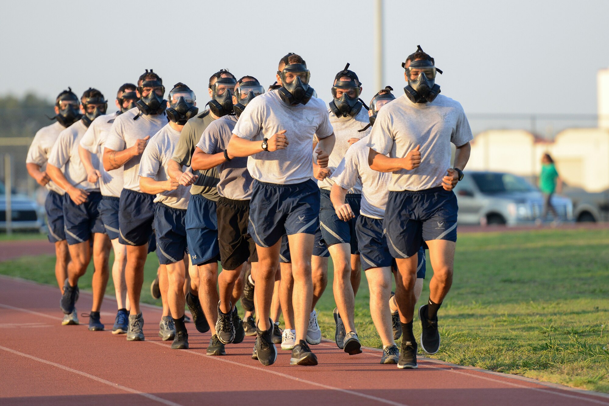 Air Education and Training Command Security Forces members wear gas masks as they preform physical exercises during AETC’s Defender Challenge team selection July 27, 2018, at Joint Base San Antonio-Randolph, Texas. Defender Challenge is a Security Forces competition that pits teams against each other in realistic weapons, dismounted operations and relay challenge events.