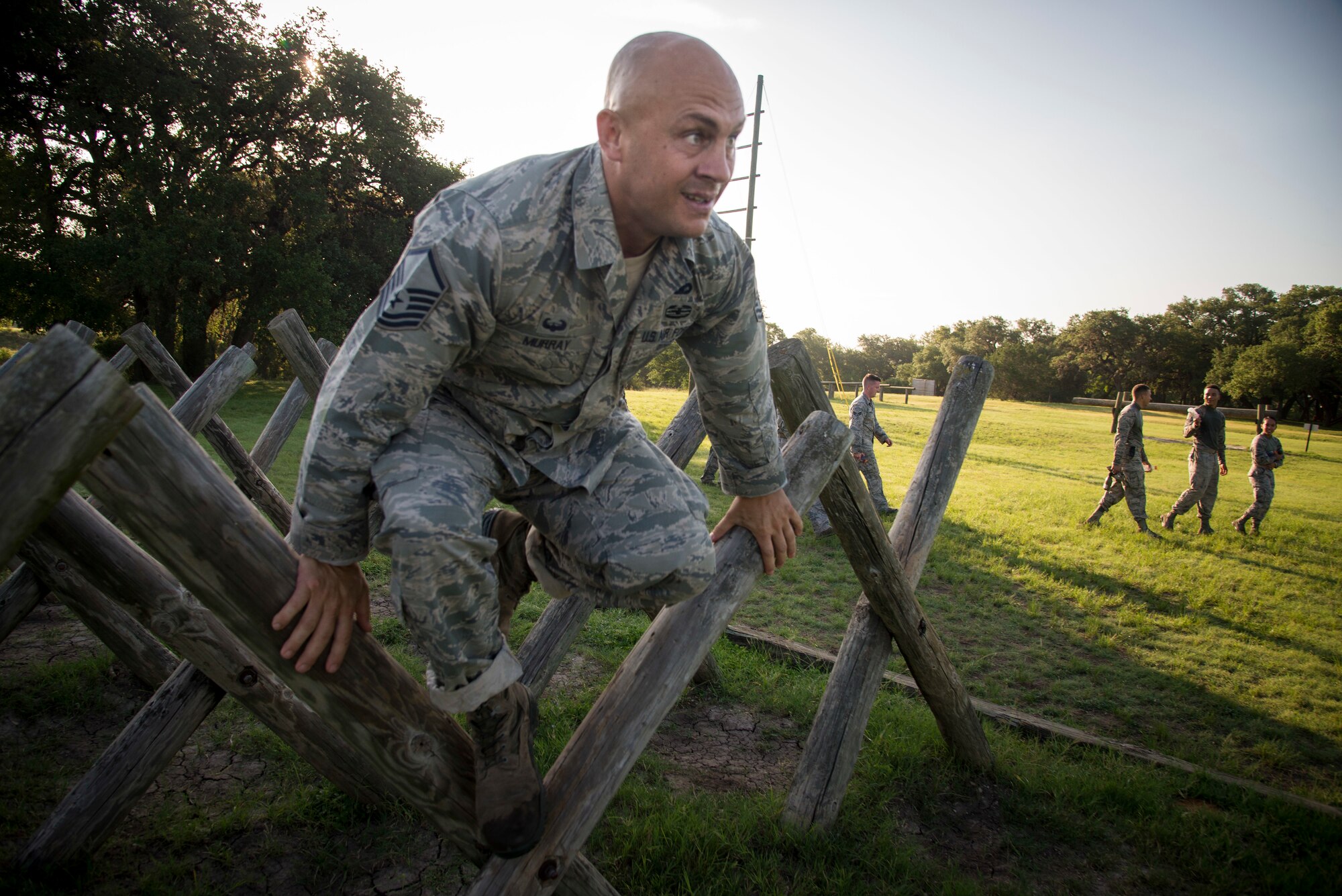 U.S. Air Force Airman Master Sgt. James Murray, 802nd Security Forces Squadron, jumps over an obstacle during the Air Education and Training Command’s Defender Challenge team selection July 23, 2018, at Joint Base San Antonio-Camp Bullis, Texas. Defender Challenge is a Security Forces competition that pits teams against each other in realistic weapons, dismounted operations and relay challenge events.