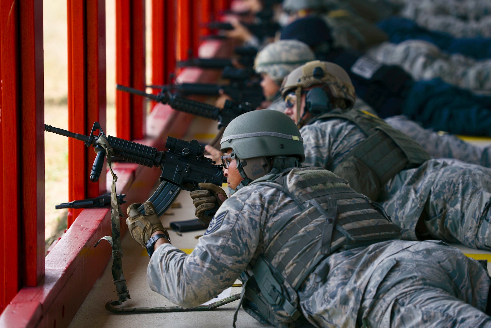 U.S. Air Force Technical Sgt. Cory Irvin, 37th Training Support Squadron combat arms training and maintenance instructor, inserts a magazine into his M-4 rifle during the Air Education and Training Command’s Defender Challenge team selection July 23, 2018, at Joint Base San Antonio-Medina Annex, Texas. Defender Challenge is a Security Forces competition that pits teams against each other in realistic weapons, dismounted operations and relay challenge events.
