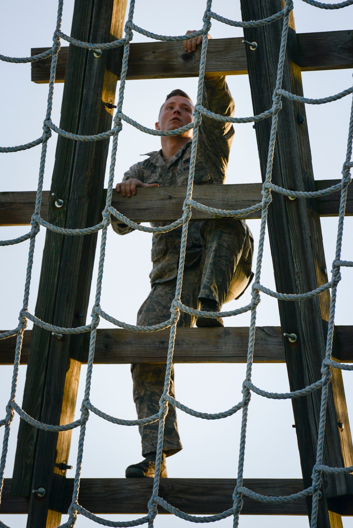 U.S. Air Force Senior Airman William McLaughlin, 502nd Security Forces Squadron, climbs an obstacle during the Air Education and Training Command’s Defender Challenge team selection July 23, 2018, at Joint Base San Antonio-Medina Annex, Texas. Defender Challenge is a Security Forces competition that pits teams against each other in realistic weapons, dismounted operations and relay challenge events.