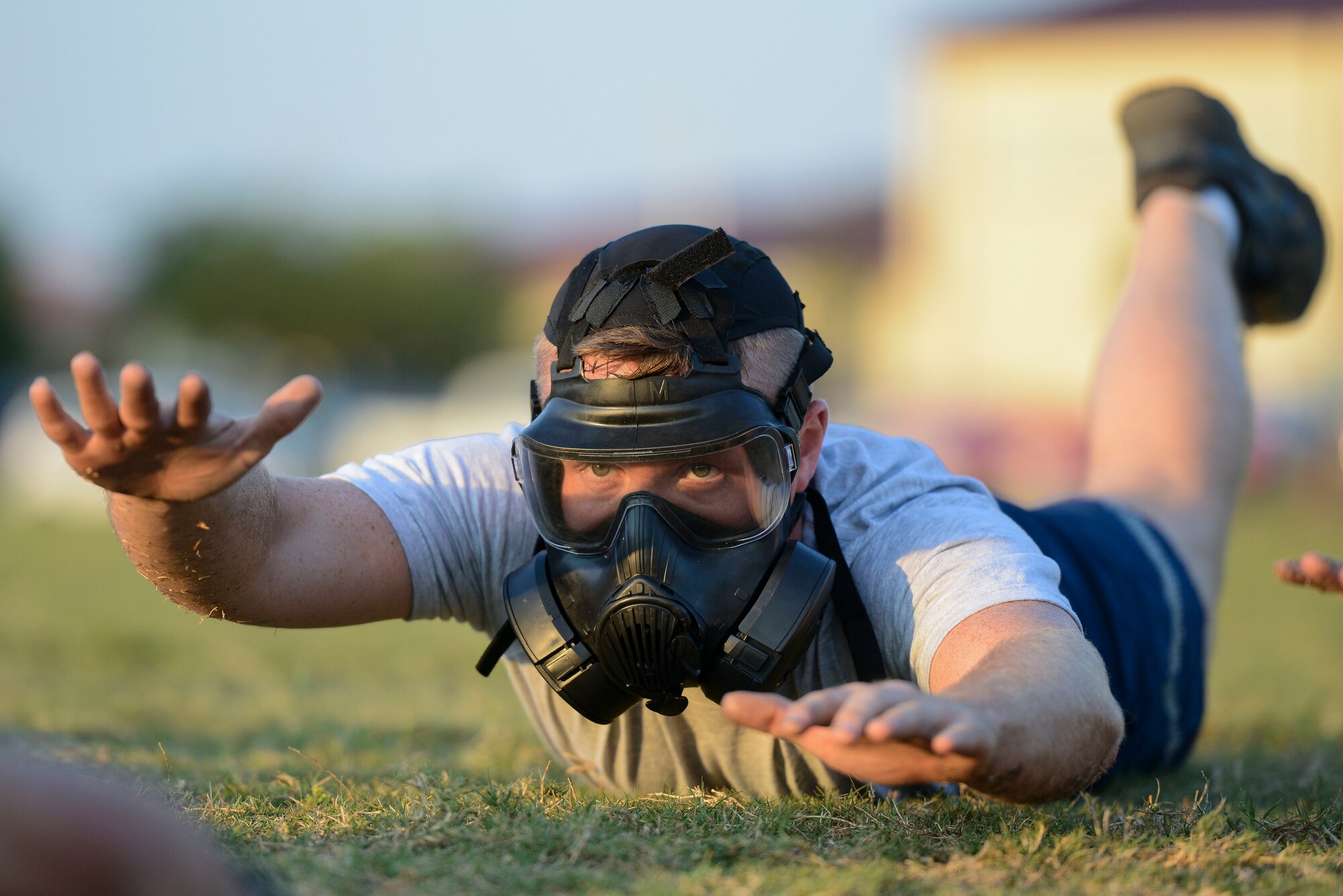 U.S. Air Force Senior Airman William McLaughlin, 502nd Security Forces Squadron, performs a physical training exercise during the Air Education and Training Command’s Defender Challenge team selection July 27, 2018, at Joint Base San Antonio-Randolph, Texas. Defender Challenge is a Security Forces competition that pits teams against each other in realistic weapons, dismounted operations and relay challenge events.