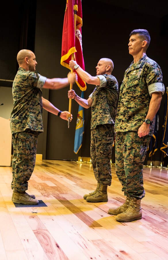 Sgt. Maj. Darby J. Noonan, Force Headquarters Group sergeant major, passes the FHG colors to Maj. Gen. Michael F. Fahey, outgoing commander of FHG, for the final time as he prepares to turn over the command to Brig. Gen. Mark Hashimoto at the Federal City Auditorium, New Orleans, Aug. 3, 2018. Fahey served as the commander of FHG from 2016-2018. (U.S. Marine Corps photo by Sgt. Melissa Martens)