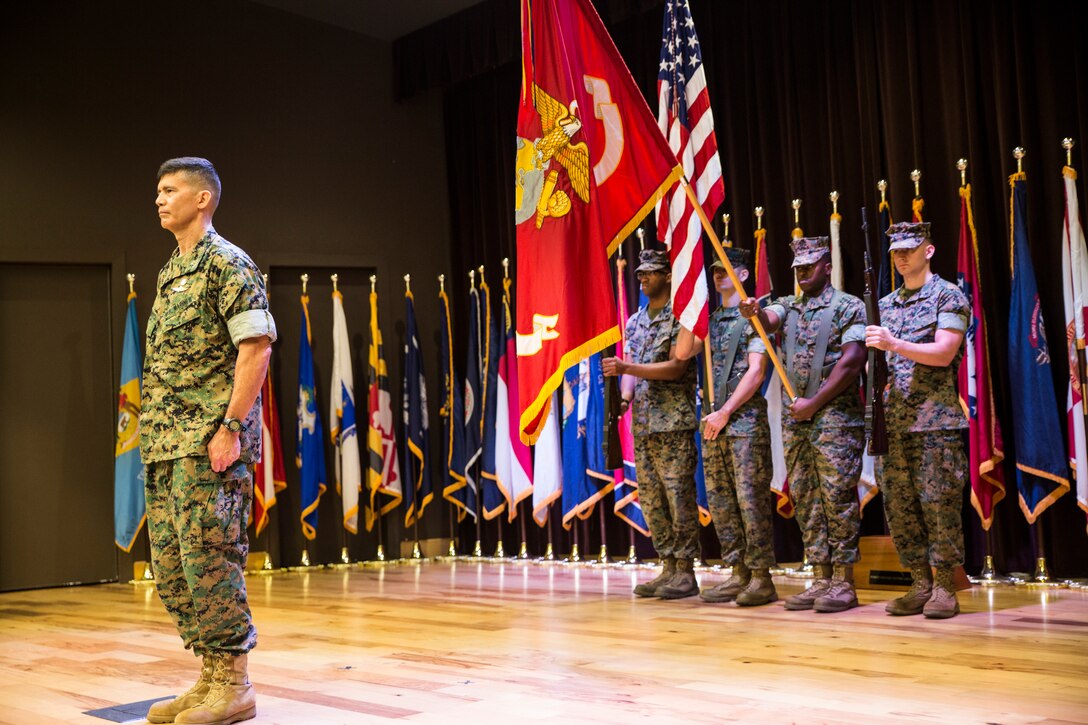 Brig. Gen. Mark Hashimoto, commander of Force Headquarters Group, stands at attention as the colors are presented in honor of Hashimoto taking command of FHG at the Federal City Auditorium, New Orleans, Aug. 3, 2018. Hashimoto relieved Maj. Gen. Michael F. Fahey, who served as the commander of FHG from 2016-2018. (U.S. Marine Corps photo by Sgt. Melissa Martens)