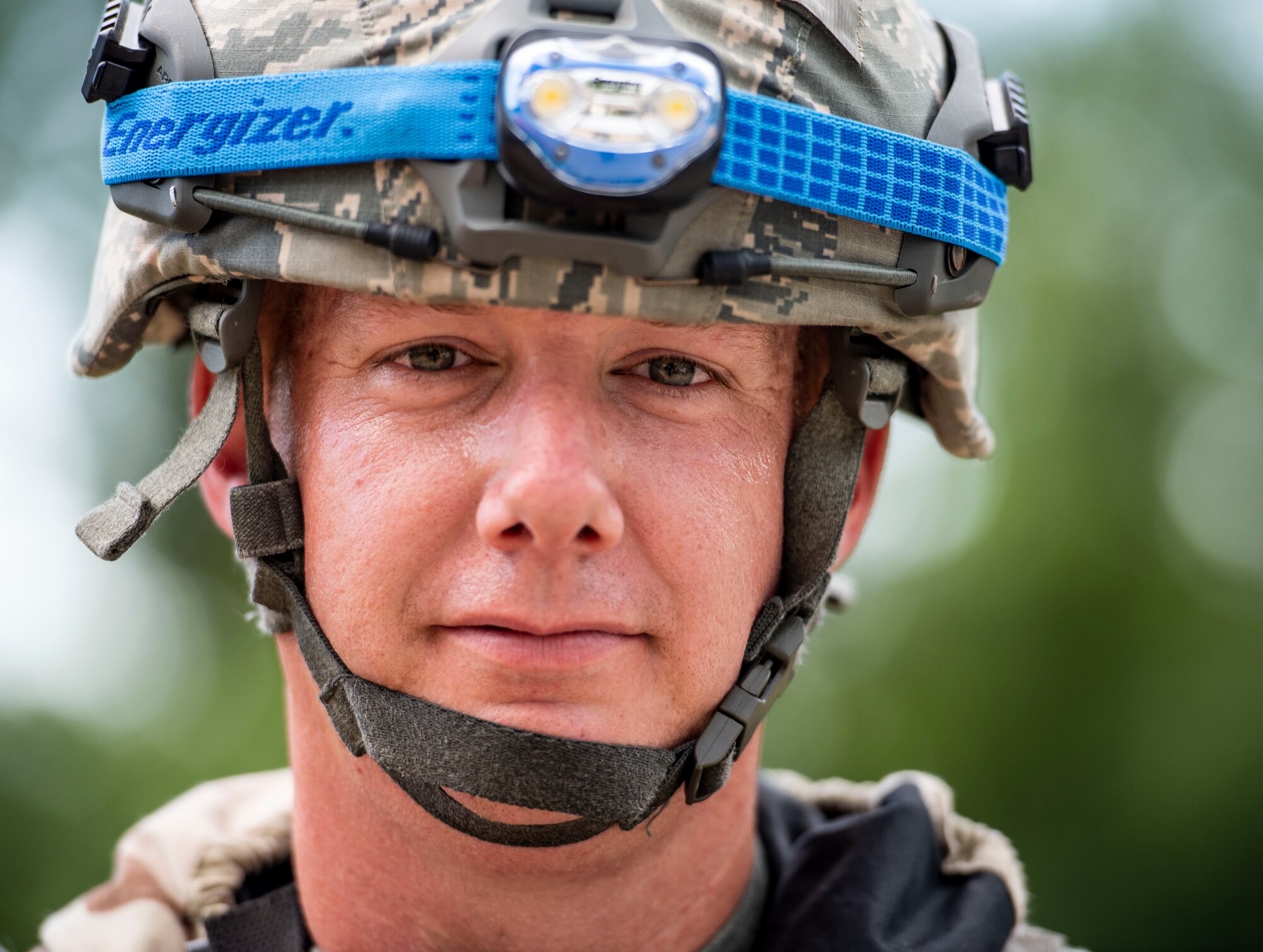 Staff Sgt. Brandon Anthis, 375th Security Forces Squadron patrolman, stands guard during a base exercise at Scott Air Force Base, Illinois, Aug. 2, 2018. Anthis was responsible for checking credentials of Airmen entering the training area. (U.S. Air Force photo by Airman 1st Class Tara Stetler)