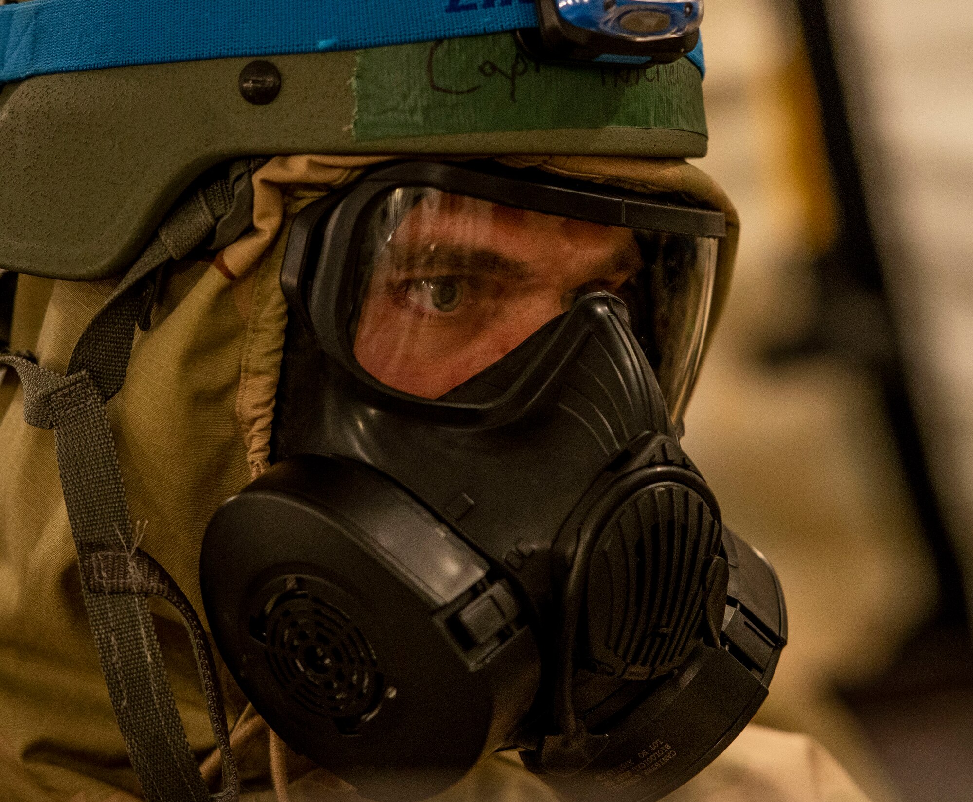 Capt. Brett Hutcherson, 375th Medical Operations Squadron family medicine faculty technician, checks his Airmen to ensure they properly put on their MOPP gear during a base exercise, Aug. 2, 2018, at Scott Air Force Base, Illinois. Airmen with the 375th MOS were responsible for tending to mock casualties after a simulated chemical attack. (U.S. Air Force photo by Airman 1st Class Tara Stetler)