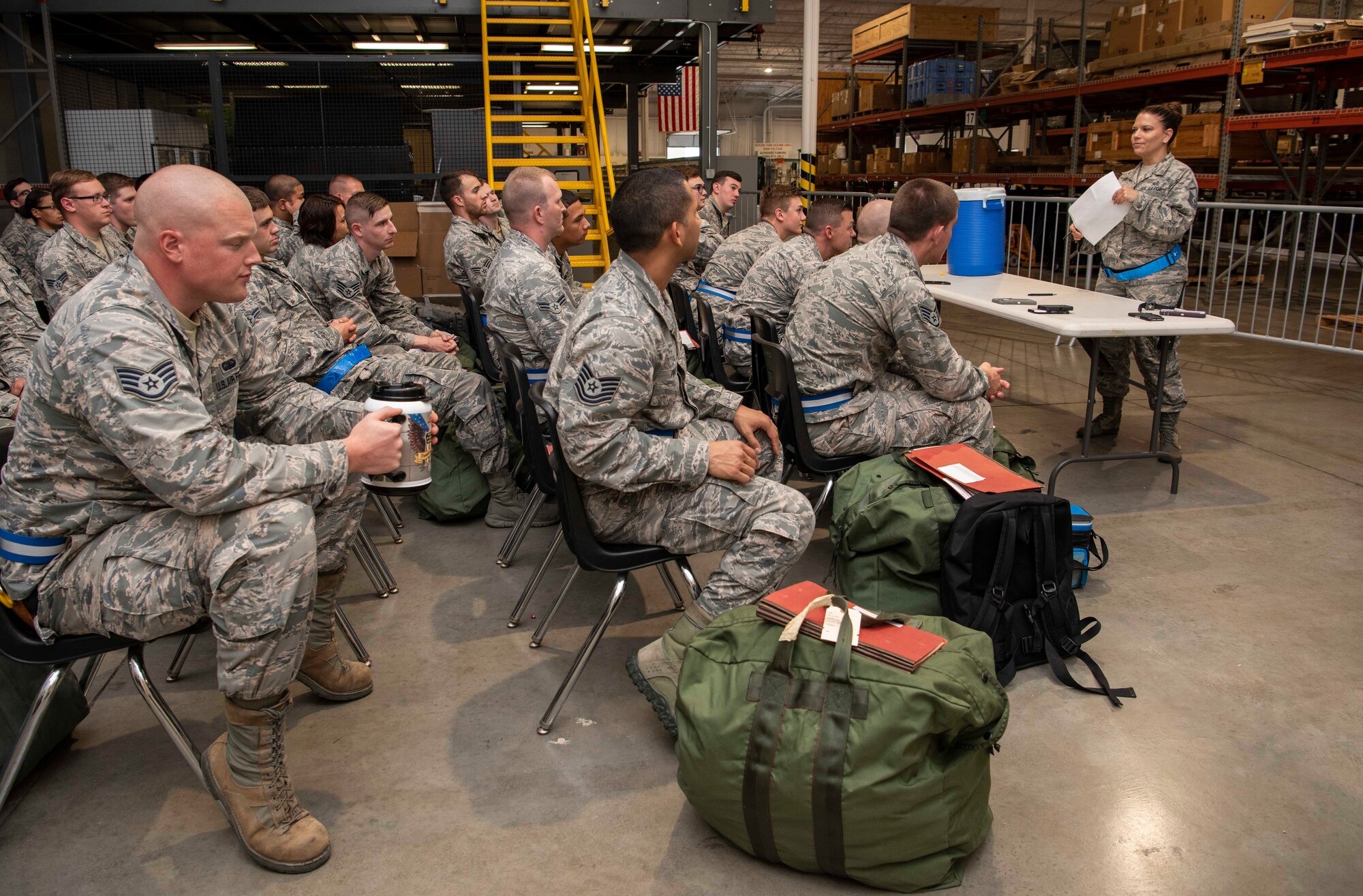 Airmen with the 375th Logistics Readiness Squadron prepare Airmen for a mobility exercise, July 30, 2018, at Scott Air Force Base, Illinois. After completing the simulated pre-deployment process, Airmen were bussed to the training area. (U.S. Air Force photo by Senior Airman Melissa Estevez)