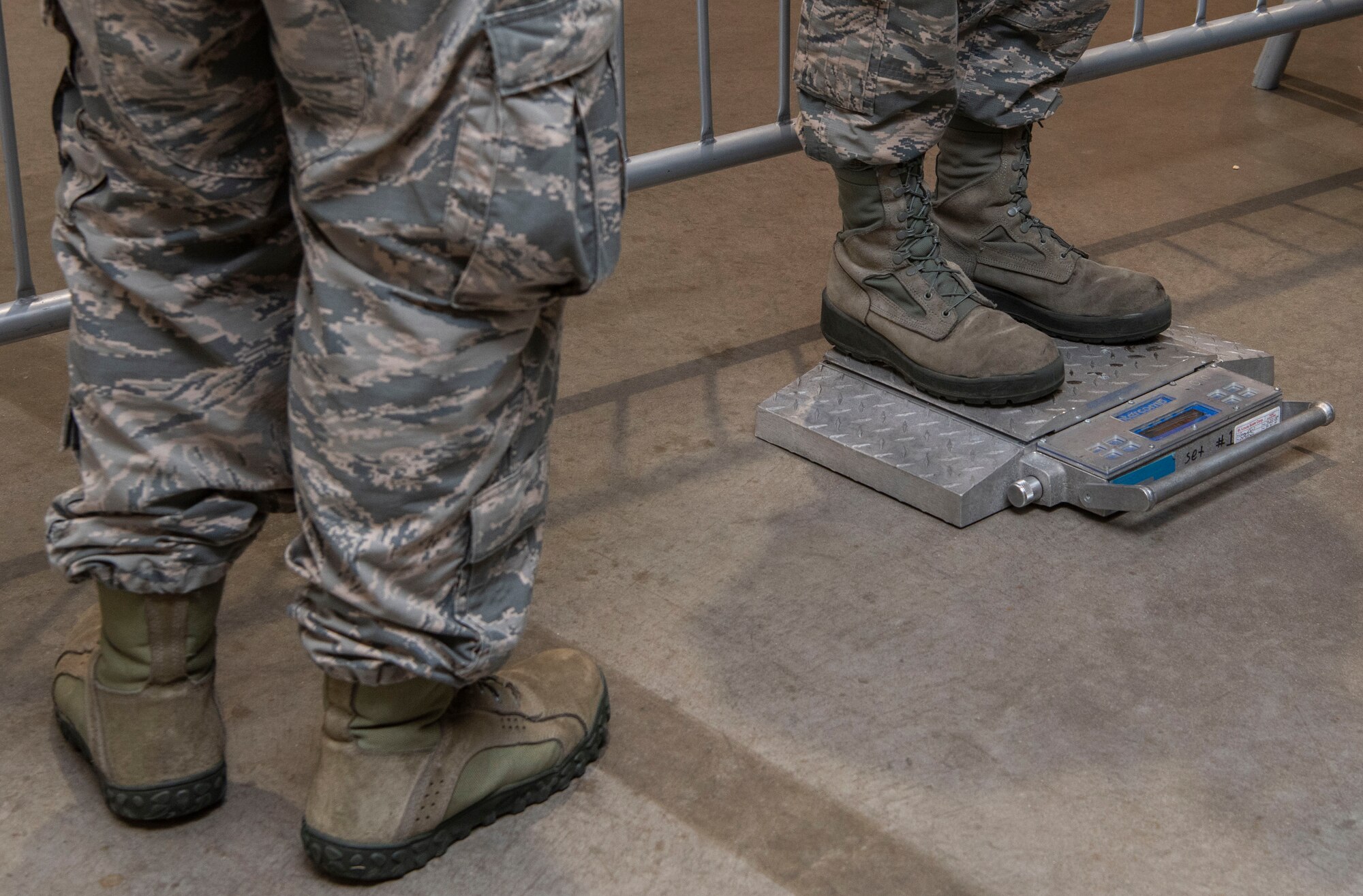Airmen participating in a base mobility exercise weigh their gear, July 30, 2018, at Scott Air Force Base, Illinois. The exercise lasted five days and tested Airmen’s ability to swiftly and properly respond to simulated explosions and chemical attacks. (U.S. Air Force photo by Senior Airman Melissa Estevez)
