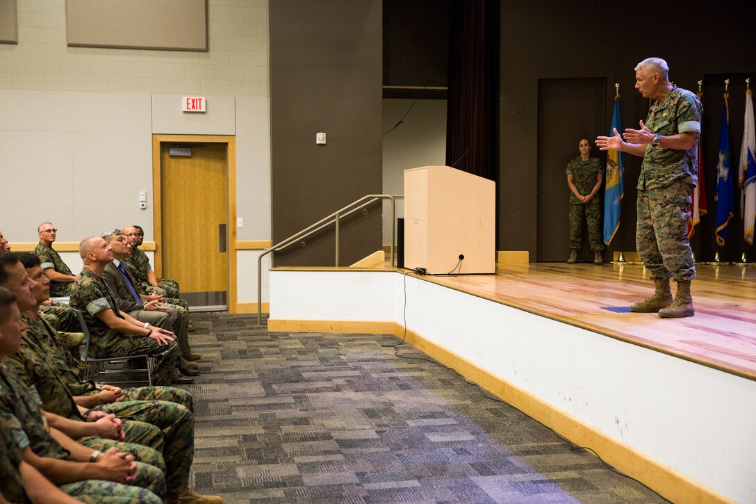 Lt. Gen. Rex. C. McMillian, commander of Marine Forces Reserve and Marine Forces North, addresses Maj. Gen. Michael F. Fahey, outgoing commander of Force Headquarters Group, during the change of command ceremony at the Federal City Auditorium, New Orleans, Aug. 3, 2018. While addressing the attendees, McMillian expressed his gratitude for all the hard work and dedication Fahey gave to FHG during his time as the commander from 2016-2018. (U.S. Marine Corps photo by Sgt. Melissa Martens)