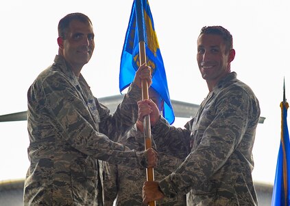 Lt. Col. David Morales, 437th Operations Support Squadron outgoing commander, is awarded the Meritorious Service Medal by Col. Daniel Dobbels, 437th Operations Group commander, during a change of command ceremony, Aug. 3, 2018 at Joint Base Charleston. The 437th OSS is responsible for airfield management, life support services, flight records management, weather and intelligence support, airlift scheduling, tactical employment and aircrew training for approximately 1,400 active and reserve service members.