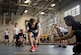 Airmen and Sailors cheer on a classmate during the Alpha Warrior Air Force Fitness Tour Level 1 Battle Rig Instructor Course Aug. 1, 2018, at the Fitness Center at Joint Base Charleston, S.C.