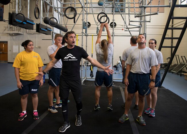 Airmen and Sailors explore challenging obstacles inside the Alpha Warrior Battle Rig during the Alpha Warrior Air Force Fitness Tour Level 1 Battle Rig Instructor Course Aug. 1, 2018, at the Fitness Center at Joint Base Charleston, S.C.
