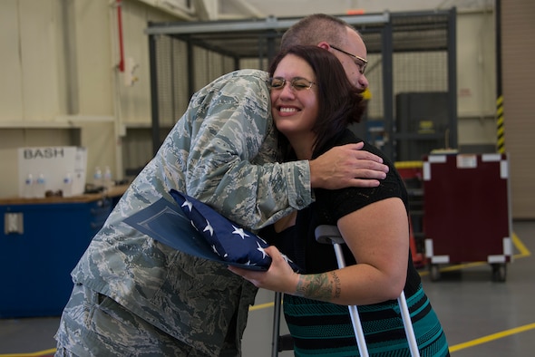 Maj. Eikner presents Ms. KaSandra Gray with a new flag flown over Afghanistan.