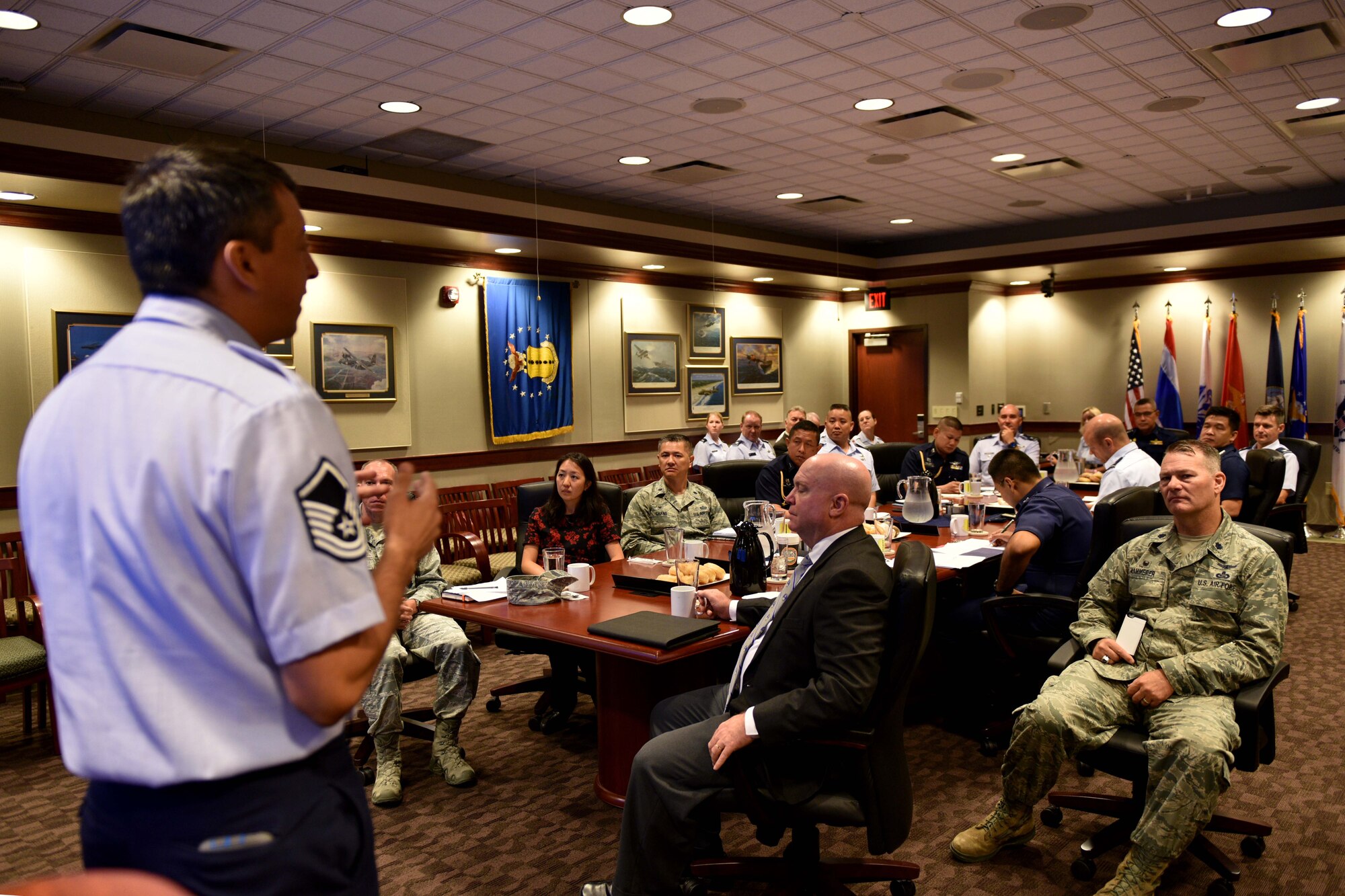 U.S. Air Force Master Sgt. Douglas Earl, 17th Training Group superintendent of standards and evaluations, presents a wing mission brief to Royal Thai air force, Pacific Air Forces and 17th Training Wing leadership in the Norma Brown building during a tour on Goodfellow Air Force Base, Texas, Aug. 2, 2018. The 17th TRW’s mission is to train, develop and inspire exceptional intelligence, surveillance and reconnaissance and fire protection professionals for America and her allies. (U.S. Air Force photo by Senior Airman Randall Moose/Released)