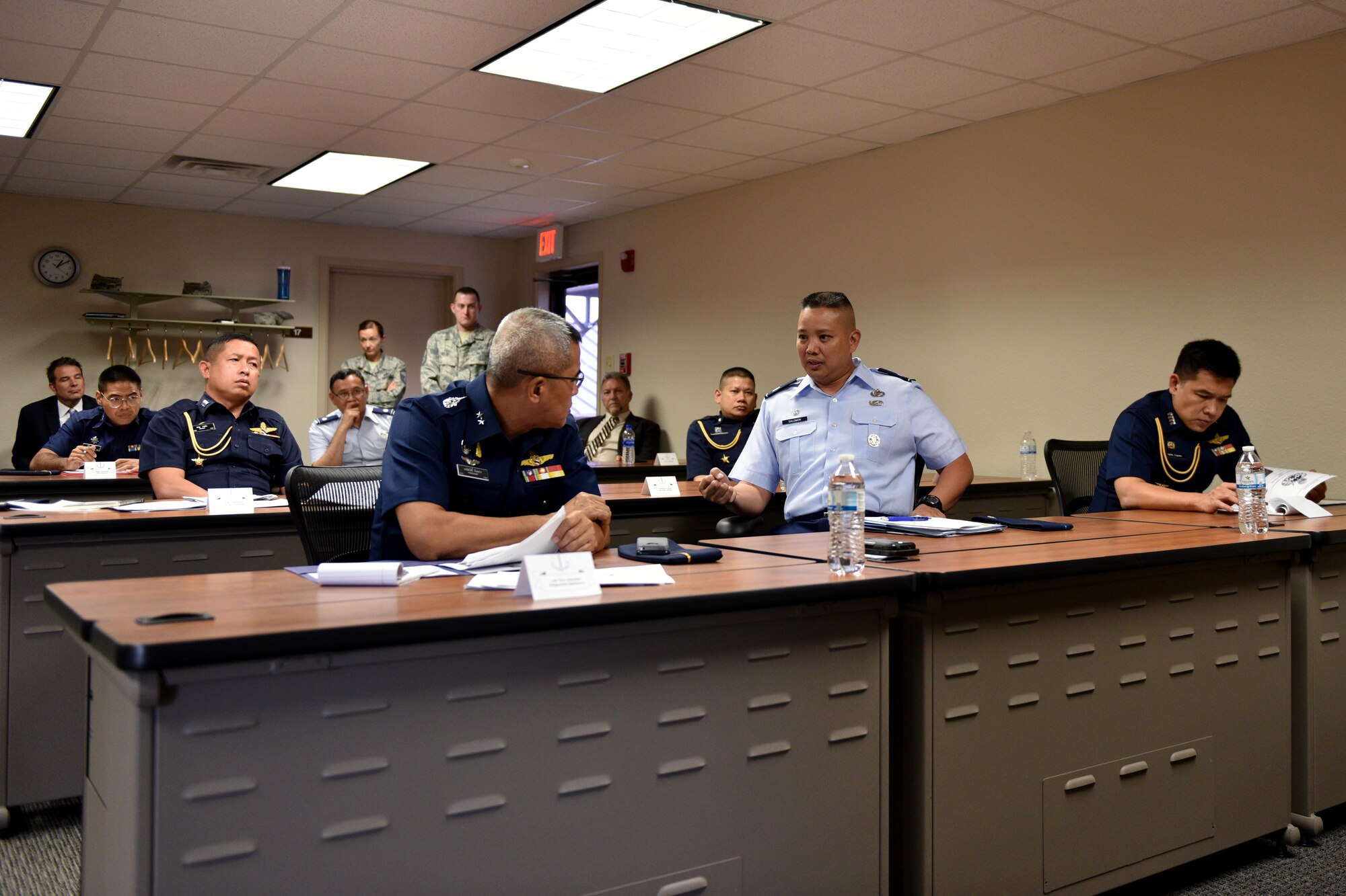 U.S. Air Force Lt. Col. Abraham Salomon, 17th Training Group deputy commander, highlights 17th Training Wing’s international training to Royal Thai air force Air Vice Marshall Pongsawat Jantasarn, in the International Training Center on Goodfellow Air Force Base, Texas, Aug. 2, 2018. The visit reinforced the 17th TRG’s vision to set the standard for fully integrated intelligence training and education. (U.S. Air Force photo by Senior Airman Randall Moose/Released)