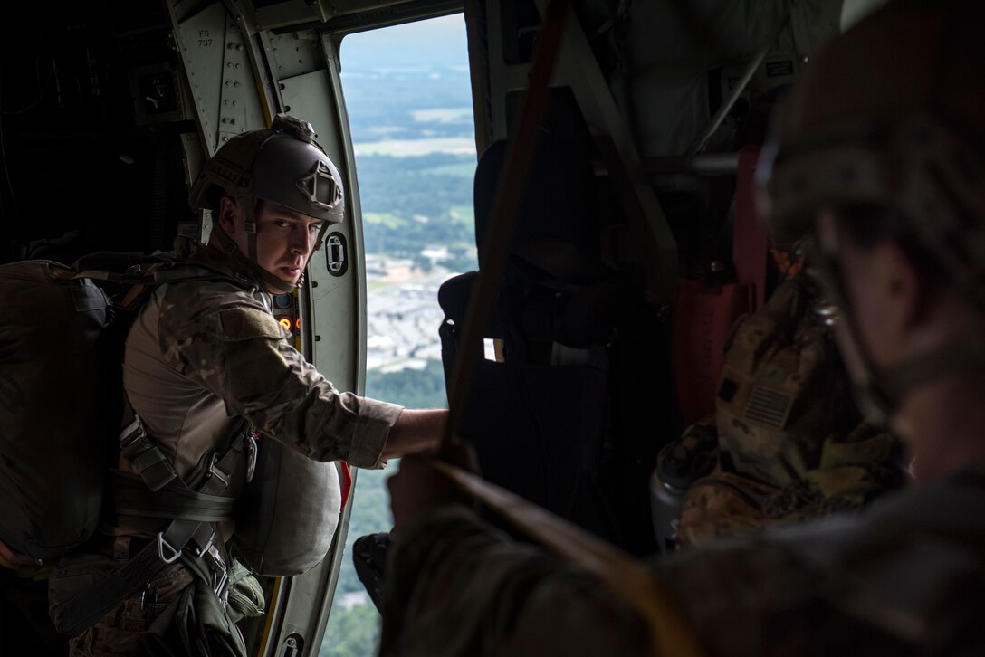 Airmen from the 820th Base Defense Group prepare for a static-line jump from an HC-130J Combat King II, July 31, 2018, in the skies over South Georgia. The 820th BDG includes airborne-qualified Airmen to bolster its worldwide-deployable force-protection capability and requires them to jump periodically to maintain their qualification. (U.S. Air Force photo by Staff Sgt. Ryan Callaghan)