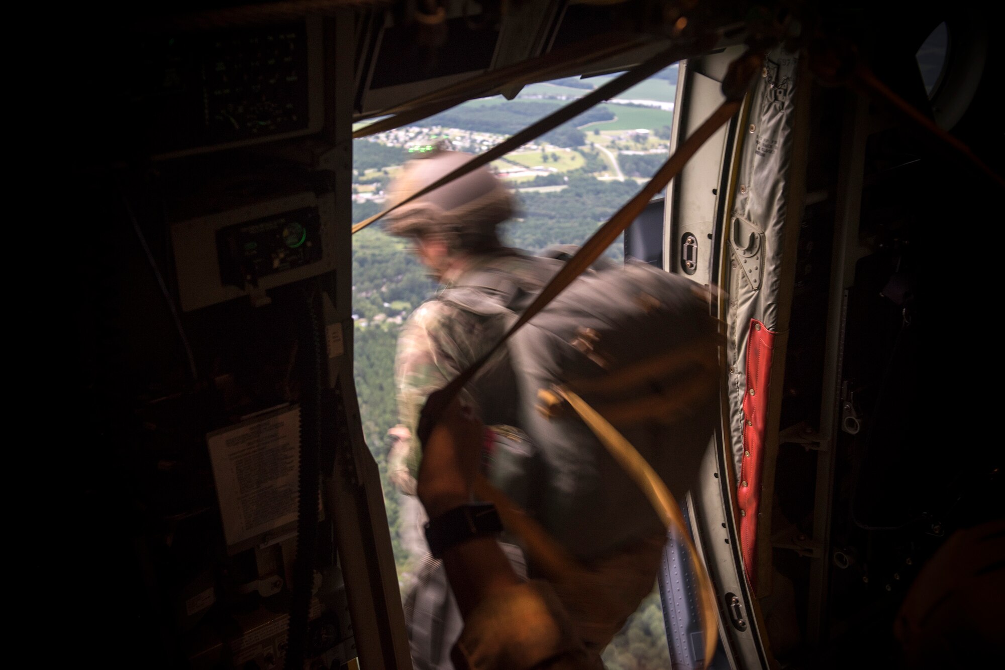 An Airman from the 820th Base Defense Group jumps from an HC-130J Combat King II, July 31, 2018, in the skies over South Georgia. The 820th BDG includes airborne-qualified Airmen to bolster its worldwide-deployable force-protection capability and requires them to jump periodically to maintain their qualification. (U.S. Air Force photo by Staff Sgt. Ryan Callaghan)