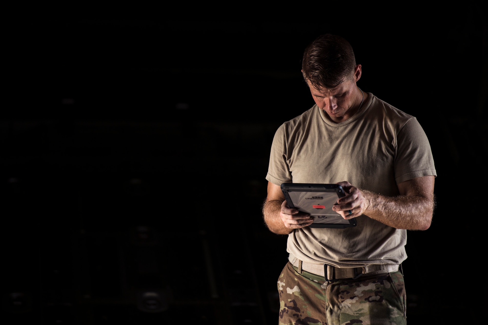Tech. Sgt. Michael Guerra, 71st Rescue Squadron loadmaster, reads a checklist prior to a flight, July 31, 2018, at Moody Air Force Base, Ga. The 71st RQS regularly trains alongside airborne-qualified Airmen from the 820th Base Defense Group to maintain proficiency and readiness for both the aircrews and the jumpers. (U.S. Air Force photo by Staff Sgt. Ryan Callaghan)