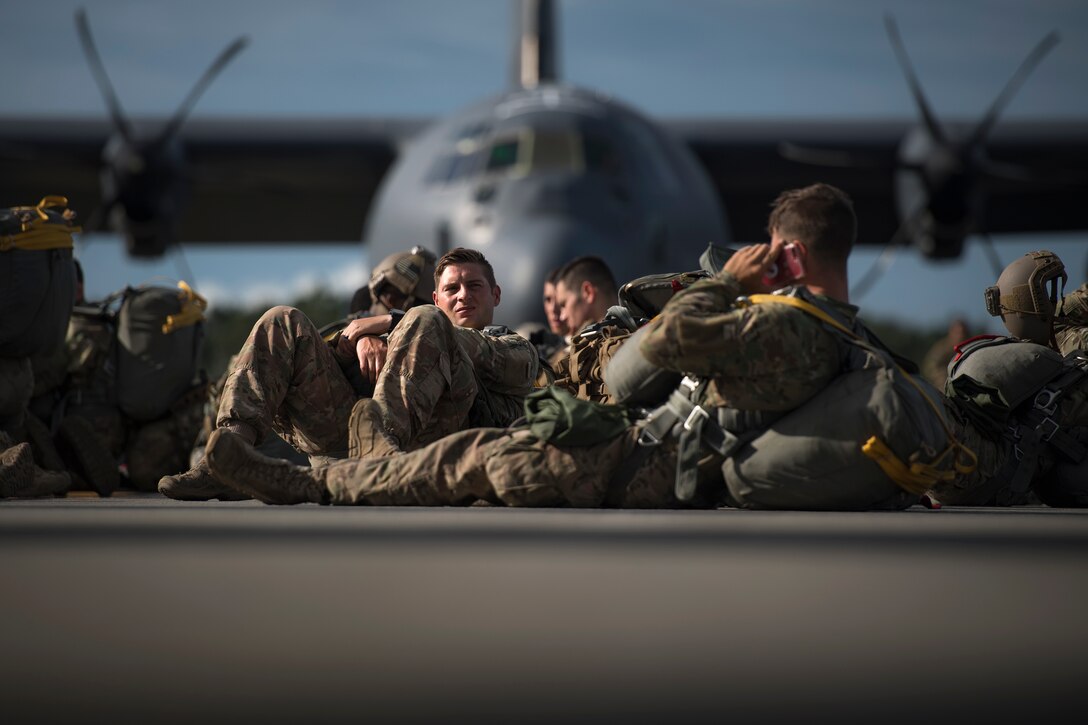 Airmen from the 820th Base Defense Group wait to board an HC-130J Combat King II for static-line jumps, July 31, 2018, at Moody Air Force Base, Ga. The 820th BDG includes airborne-qualified Airmen to bolster its worldwide-deployable force-protection capability and requires them to jump periodically to maintain their qualification. (U.S. Air Force photo by Staff Sgt. Ryan Callaghan)