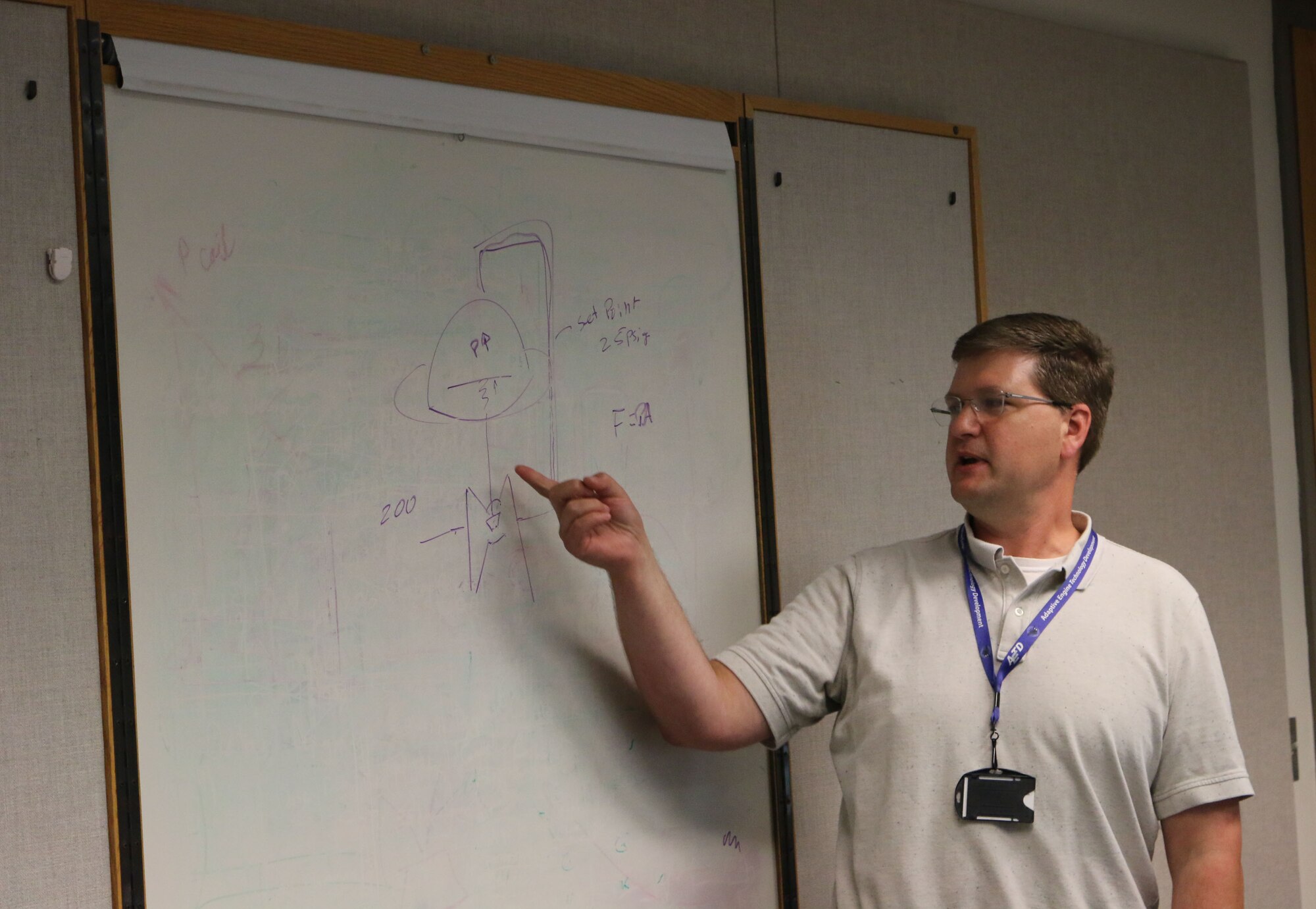 Austin Voorhes, a senior mechanical design engineer at Arnold Air Force Base, discusses steam regulators during a lunch and learn session in the Carroll Building on July 25. Voorhes was recently recognized for establishing the lunch and learns at Arnold. More than 100 lunch and learns have been held since Voorhes began the effort a little more than three years ago. (U.S. Air Force photo by Bradley Hicks)