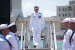 PEARL HARBOR (August 3, 2018) - Cmdr. Dave Edgerton, outgoing commanding officer of Los Angles-class fast-attack submarine USS Columbia (SSN 771) walks of the submarine after the change of command ceremony on the historic submarine piers at Joint Base Pearl Harbor-Hickam, August 3. Cmdr. Tyler Forrest relieved Cmdr. Dave Edgerton as Columbia’s commanding officer. (U.S. Navy photo by Mass Communication Specialist 1st Class Daniel Hinton)