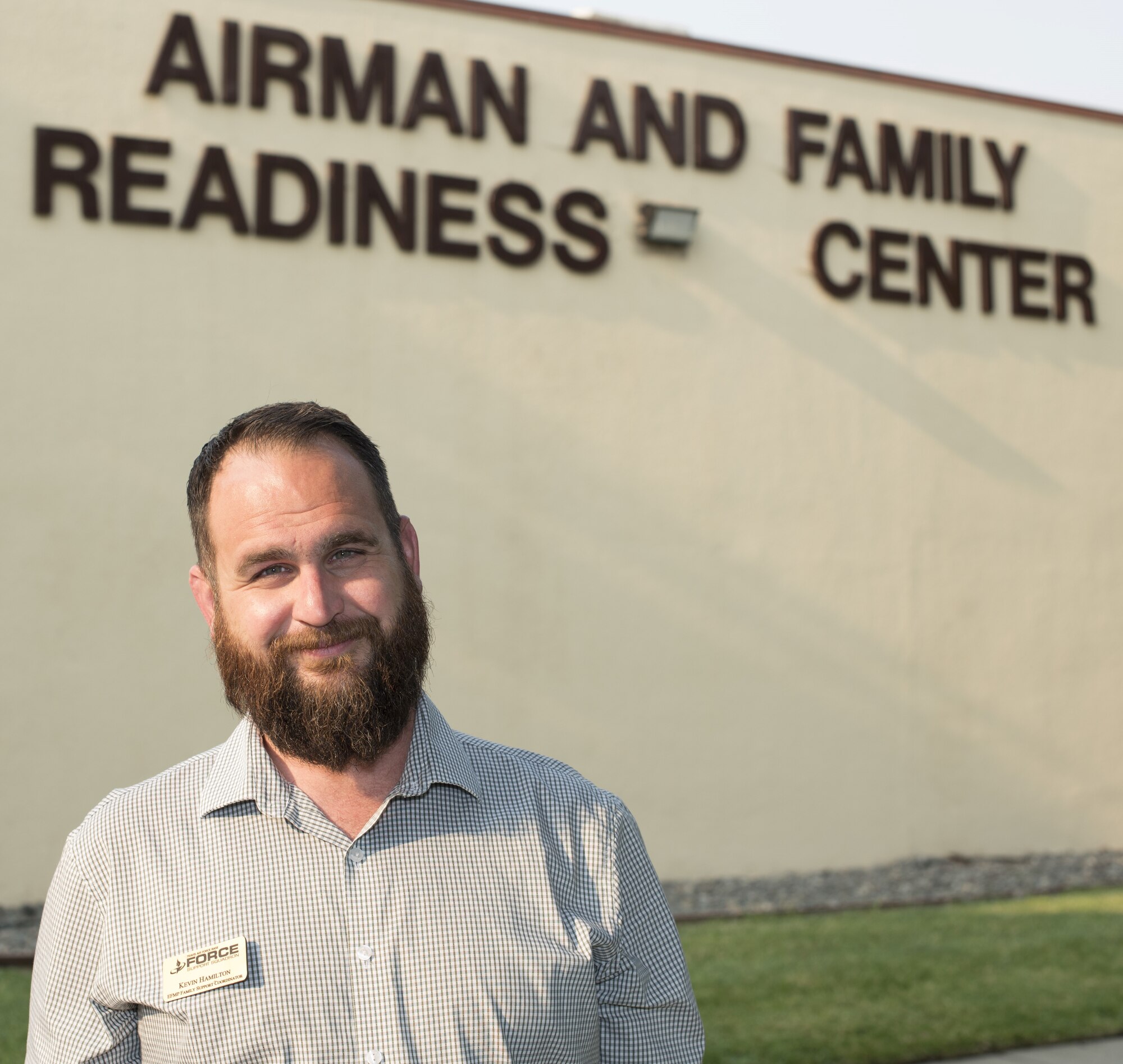 Kevin Hamilton, 60th Force Support Squadron Exceptional Family Member Program family support coordinator, poses for a photo July 31 at Travis Air Force Base, Calif. Hamilton ensures EFMP families receive the best support and care possible by providing information and setting up events for families to connect and support each other at Travis. (U.S. Air Force photo by Staff Sgt. Amber Carter)