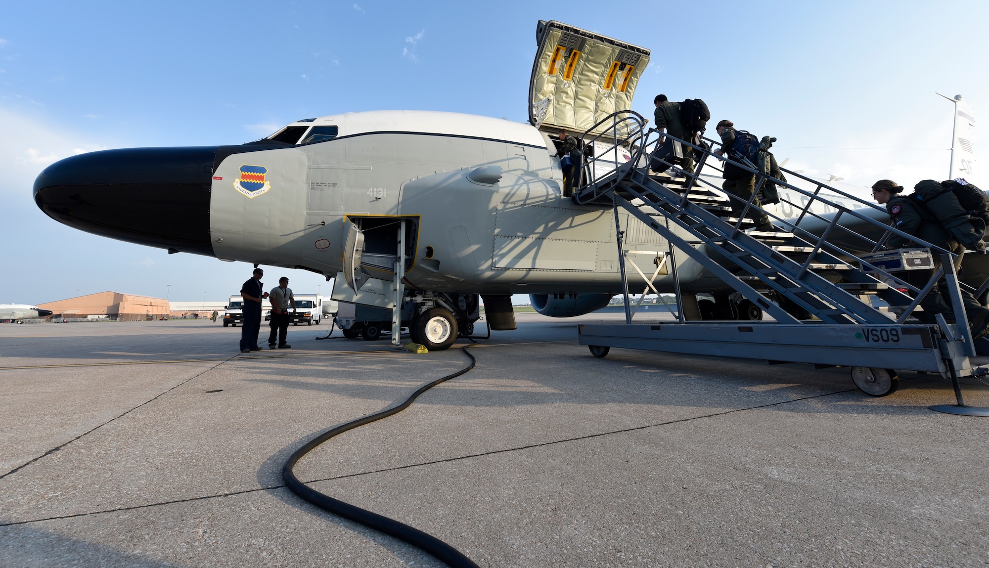 Crewmembers board an Offutt-based RC-135V/W Rivet Joint Aug. 5, 2018 before a unique training sortie which saw the flight and mission-crew comprised almost exclusively of reserve component Airmen. The aircraft is an extensively modified C-135. The Rivet Joint's modifications are primarily related to its on-board sensor suite, which allows the mission crew to detect, identify and geolocate signals throughout the electromagnetic spectrum. The mission crew can then forward gathered information in a variety of formats to a wide range of consumers via Rivet Joint's extensive communications suite. (U.S. Air Force photo by 2nd Lt. Drew Nystrom)