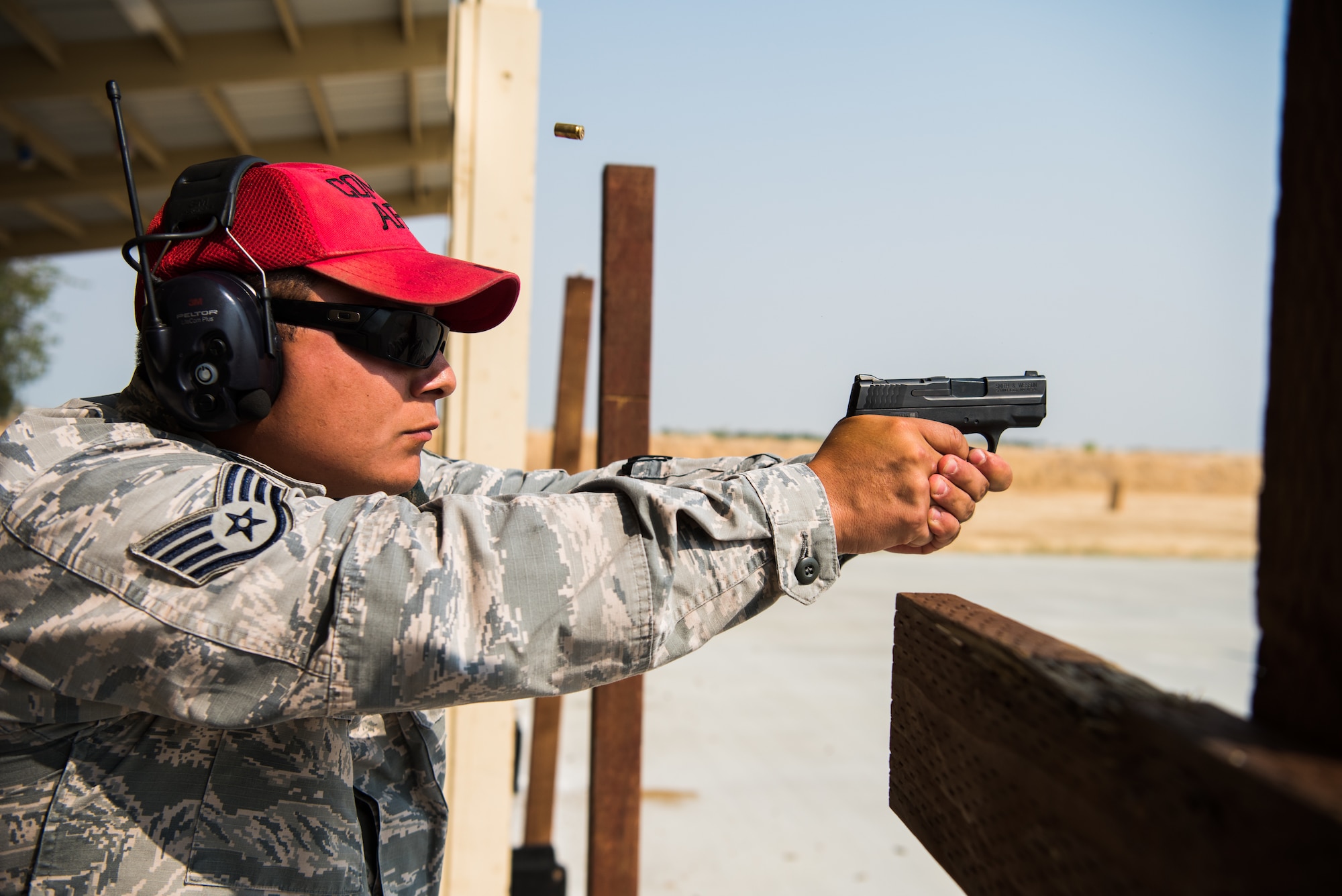 Staff Sgt. Jude Mares, 9th Security Forces combat arms training and maintenance instructor, discharges his fire arm during a training course meant to help instructors to stray proficient with weapon systems at Beale Air Force Base, California, July 31, 2018 . CATM instructors are trained at Joint Base San Antonio-Lackland, Texas and are recertified on an annual basis by their shops NCOIC. (U.S. Air Force photo by Senior Airman Justin Parsons)