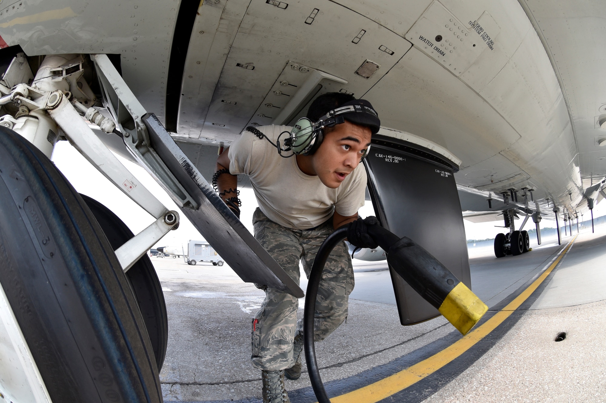 Senior Airman Angel Marroquin, 55th Aircraft Maintenance Squadron, disconnects an external power cord from a RC-135V/W Rivet Joint Aug. 5, 2018 at Offutt Air Force Base, Nebraska. The aircraft is an extensively modified C-135. The Rivet Joint's modifications are primarily related to its on-board sensor suite, which allows the mission-crew to detect, identify and geolocate signals throughout the electromagnetic spectrum. The mission-crew can then forward gathered information in a variety of formats to a wide range of consumers via Rivet Joint's extensive communications suite. (U.S. Air Force photo by 2nd Lt. Drew Nystrom)