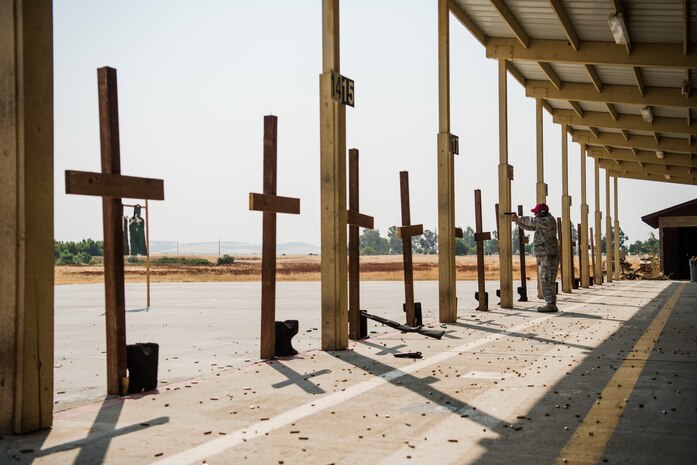 Staff Sgt. Jude Mares, 9th Security Forces combat arms training and maintenance instructor, practices various firing techniques at Beale Air Force Base, California, July 31, 2018. CATM instructors are training at Joint Base San Antonio-Lackland, Texas and are recertified on an annual basis by their shops NCOIC. (U.S. Air Force photo by Senior Airman Justin Parsons)