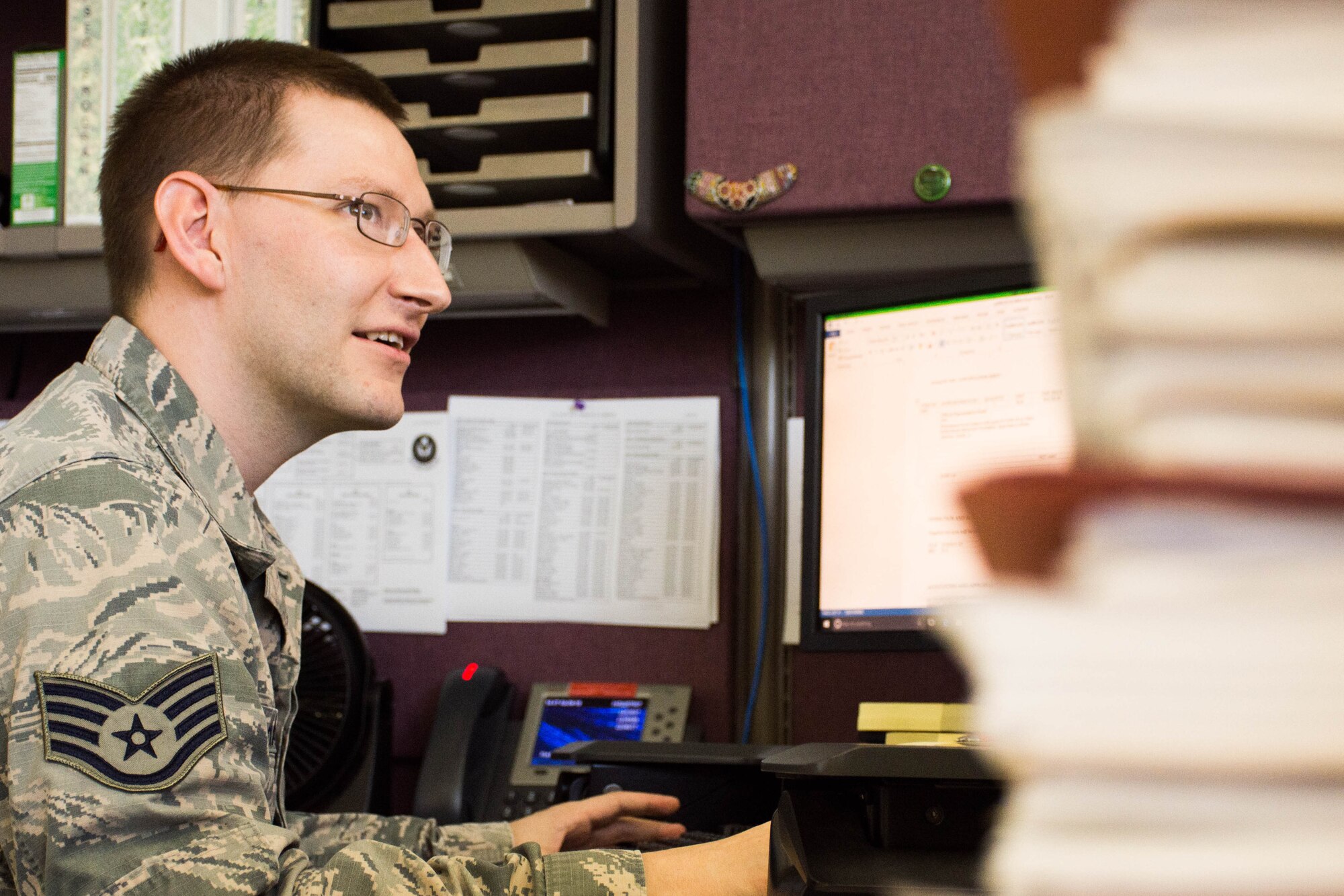 Staff Sgt. Timothy Harms, 374th Contracting Squadron contracting officer, works on contracts at Yokota Air Base, Japan, Aug. 2, 2018.