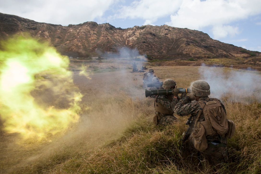 U.S. Marine Corps Lance Cpl. Shane Craig, a rifleman with Lima Company, 3rd Battalion, 3rd Marine Regiment, III Marine Expeditionary Force, fires an AT4 rocket launcher a during a combined arms exercise at the Kaneohe Bay Range Training Facility, Marine Corps Base Hawaii, Aug. 3, 2018. During the exercise, U.S. Marines utilized machine gun suppression and mortar fire on simulated enemy forces, while infantrymen assaulted forward towards them.