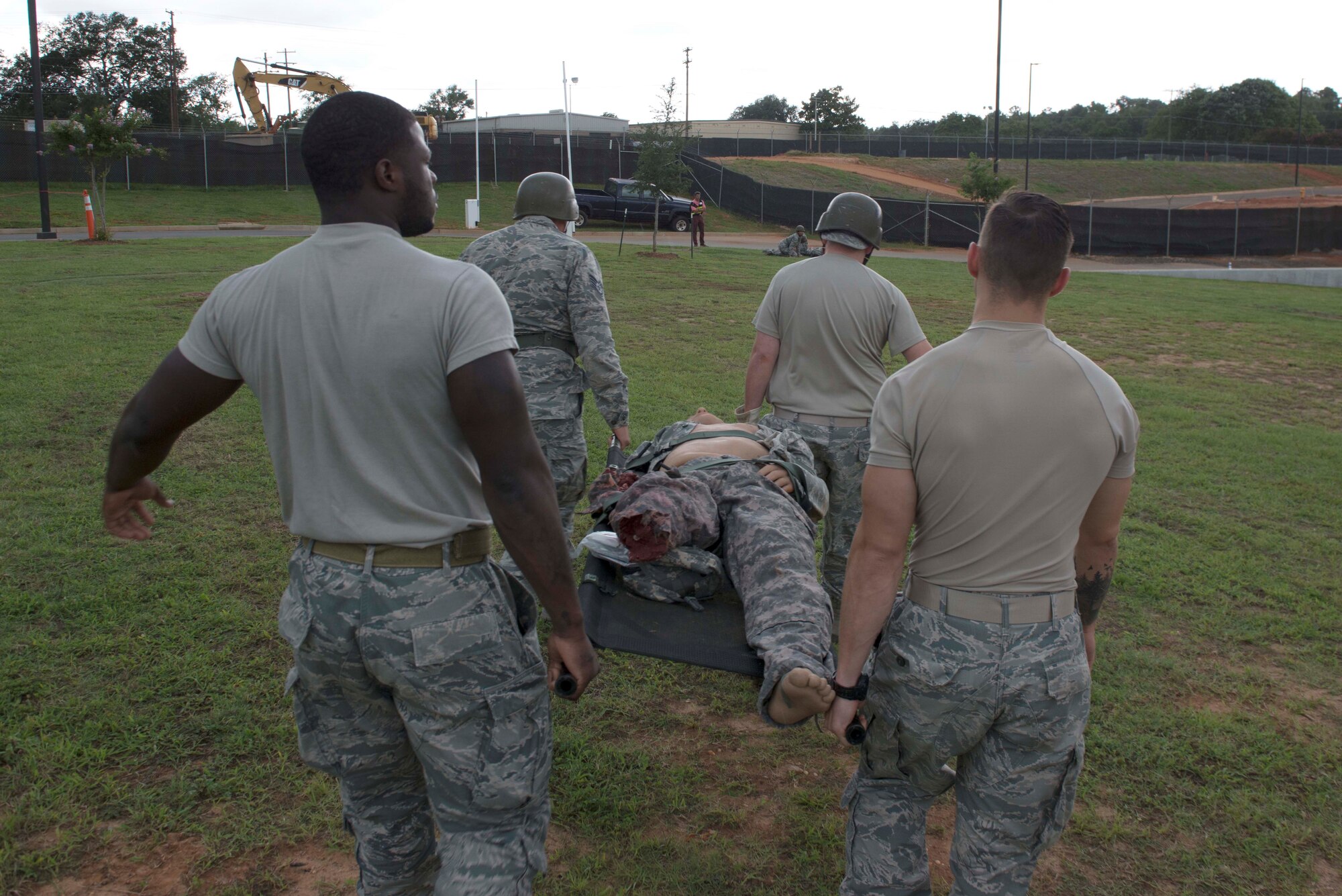 U.S. Airmen assigned to the 20th Medical Group carry a simulated patient during an exercise at Shaw Air Force Base, S.C., Aug. 2, 2018.