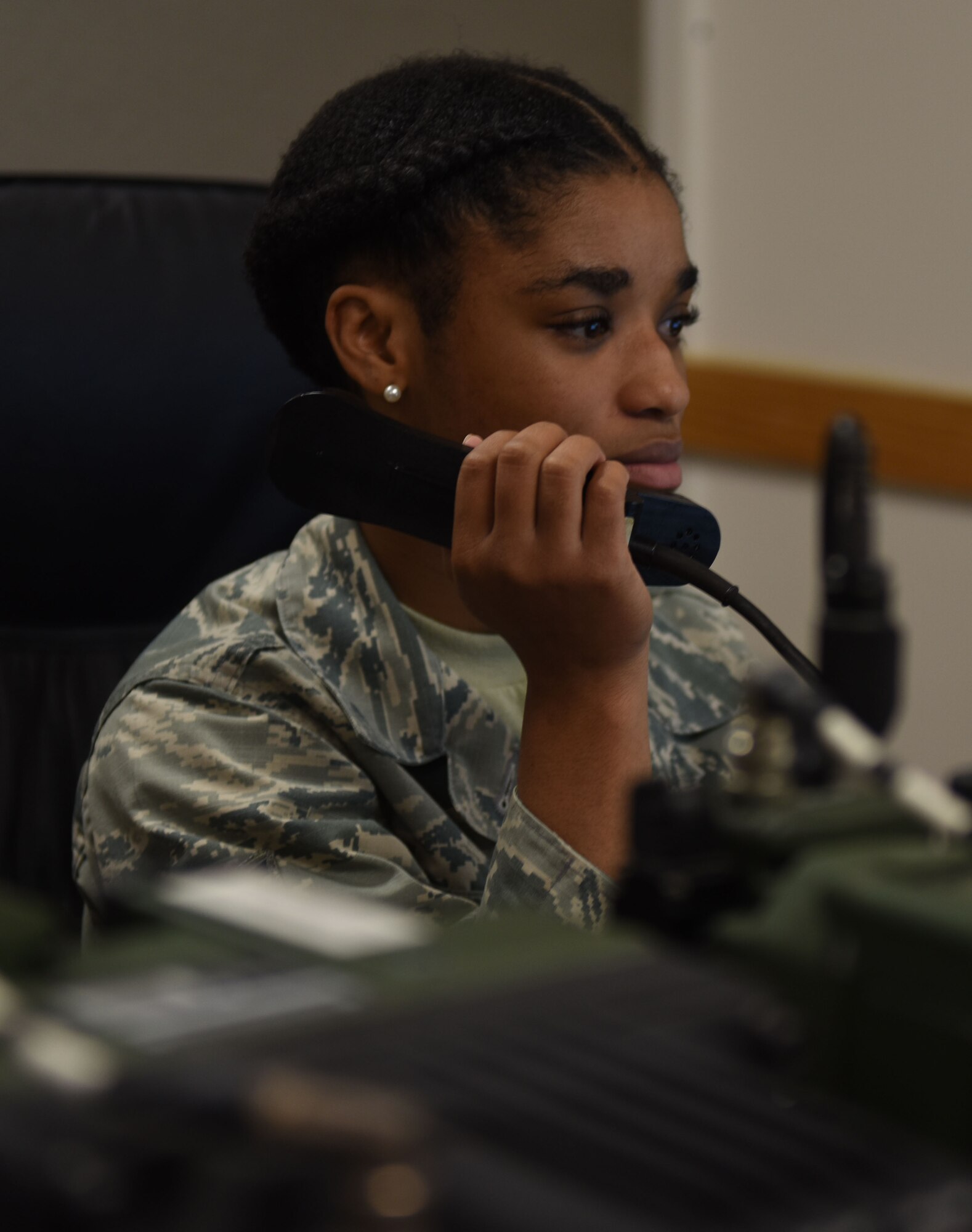 U.S. Air Force Airman 1st Class Rebecca Crockett, 77th Fighting Squadron aviation resource management journeyman, radios an F-16CM Fighter Falcon pilot at Shaw Air Force Base, S.C., Aug. 6, 2018.