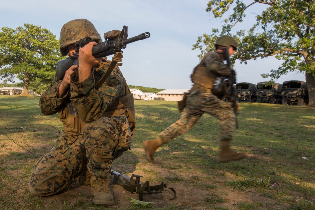 Combat Engineers with 3rd Battalion, 25th Marine Regiment, practice setting up a perimeter after destroying a notional barbed wire obstacle at Camp Grayling, Mich., in support of Exercise Northern Strike, Aug. 5, 2018.