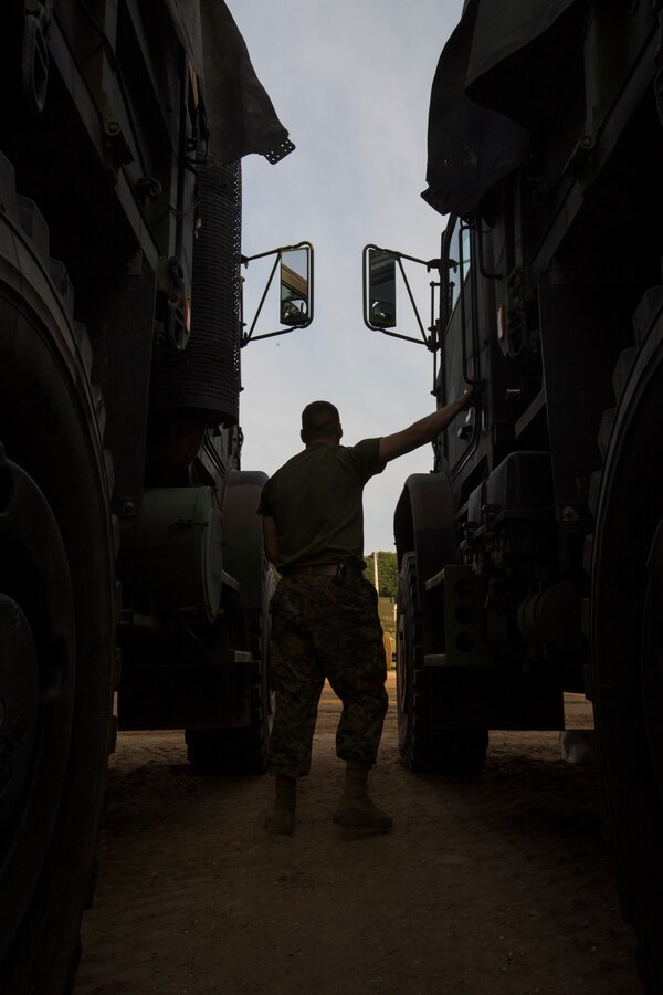 A Marine with Truck Company, Headquarters Battalion, out of Erie, Pa., inspects the cab of a 7-ton truck at Camp Grayling, Mich., in support of Exercise Northern Strike, Aug. 5, 2018. Northern Strike’s mission is to exercise participating units’ full-spectrum of capabilities through realistic, cost-effective joint fires training in an adaptable environment, with an emphasis on joint and coalition force cooperation. (U.S. Marine Corps photo by Cpl. Niles Lee)