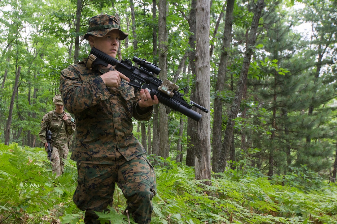 U.S. Marine Corps Sgt. Jordan Hensley a squad leader with Kilo Company, 3rd Battalion, 25th Marine Regiment, participates in a land navigation course at Exercise Northern Strike in Camp Grayling, Mich., Aug. 6, 2018.