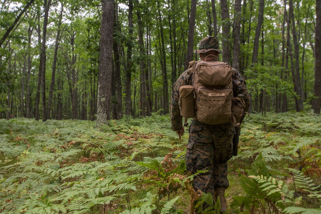 U.S. Marine Corps Sgt. Jacob Mueller a squad leader with Kilo Company, 3rd Battalion, 25th Marine Regiment, counts his steps toward a target point during a land navigation course at Exercise Northern Strike in Camp Grayling, Mich., Aug. 6, 2018.