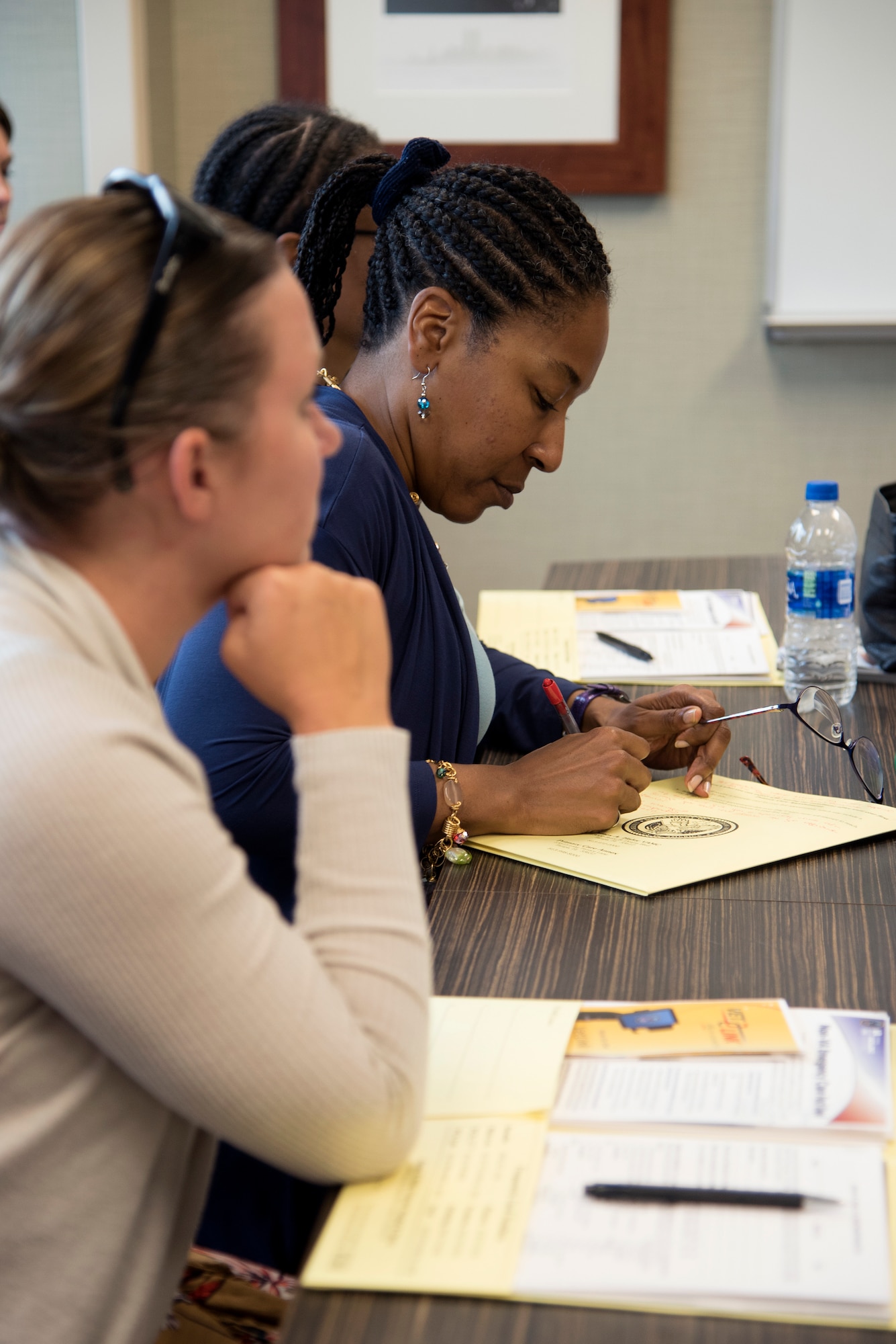Airmen attend Women’s Health Transition Pilot Program course July 31, 2018, at MacDill Air Force Base, Fla. The pilot program is an in-person course designed to provide a female perspective to active-duty, Reserve and Guard servicewomen who plan to transition to civilian or Reserve/Guard status. (U.S. Air Force photo by Senior Airman Ashley Perdue)