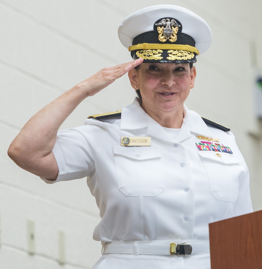 Rear Adm. Tina Davidson, incoming commander, Navy Medicine Education, Training and Logistics Command, salutes after assuming command at a ceremony at Joint Base San Antonio-Fort Sam Houston Aug. 3. Davidson relieved Rear Adm. Rebecca McCormick-Boyle during a combined change of command and retirement ceremony at JBSA-Fort Sam Houston.