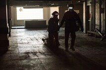 Extract Marines with Chemical Biological Incident Response Force pull a survivor out of a simulated collapsed building during Exercise Chicago Response in Champaign, Illinois, July 25, 2018. This was the first time the active duty response force trained with Chicago-area first responders and served to establish a working relationship between CBIRF and the city of Champaign and Chicago.